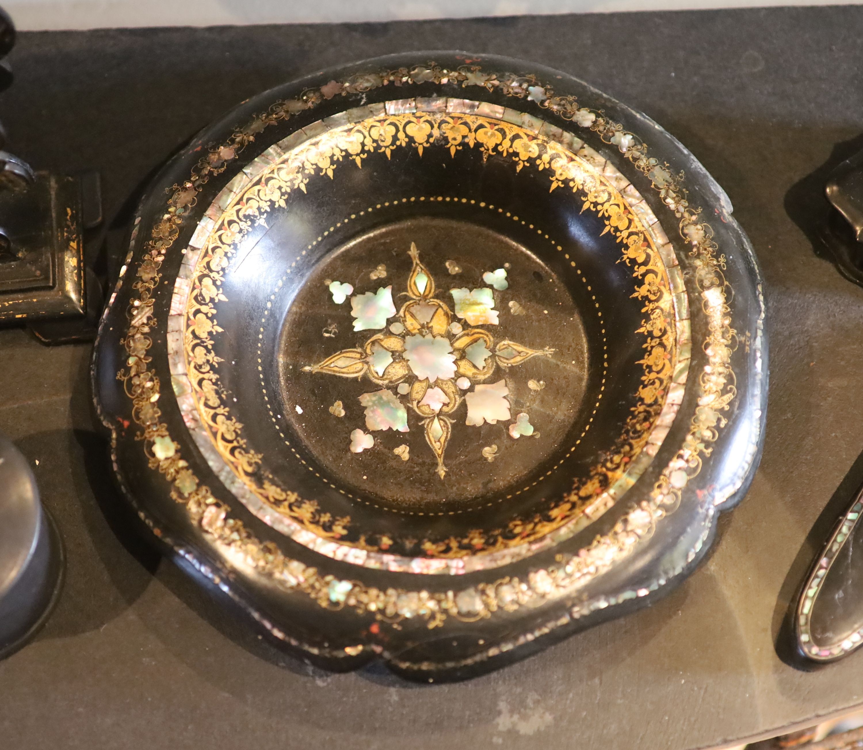 A small collection of Victorian papier mache wares comprising letter rack, bowl and three assorted boxes